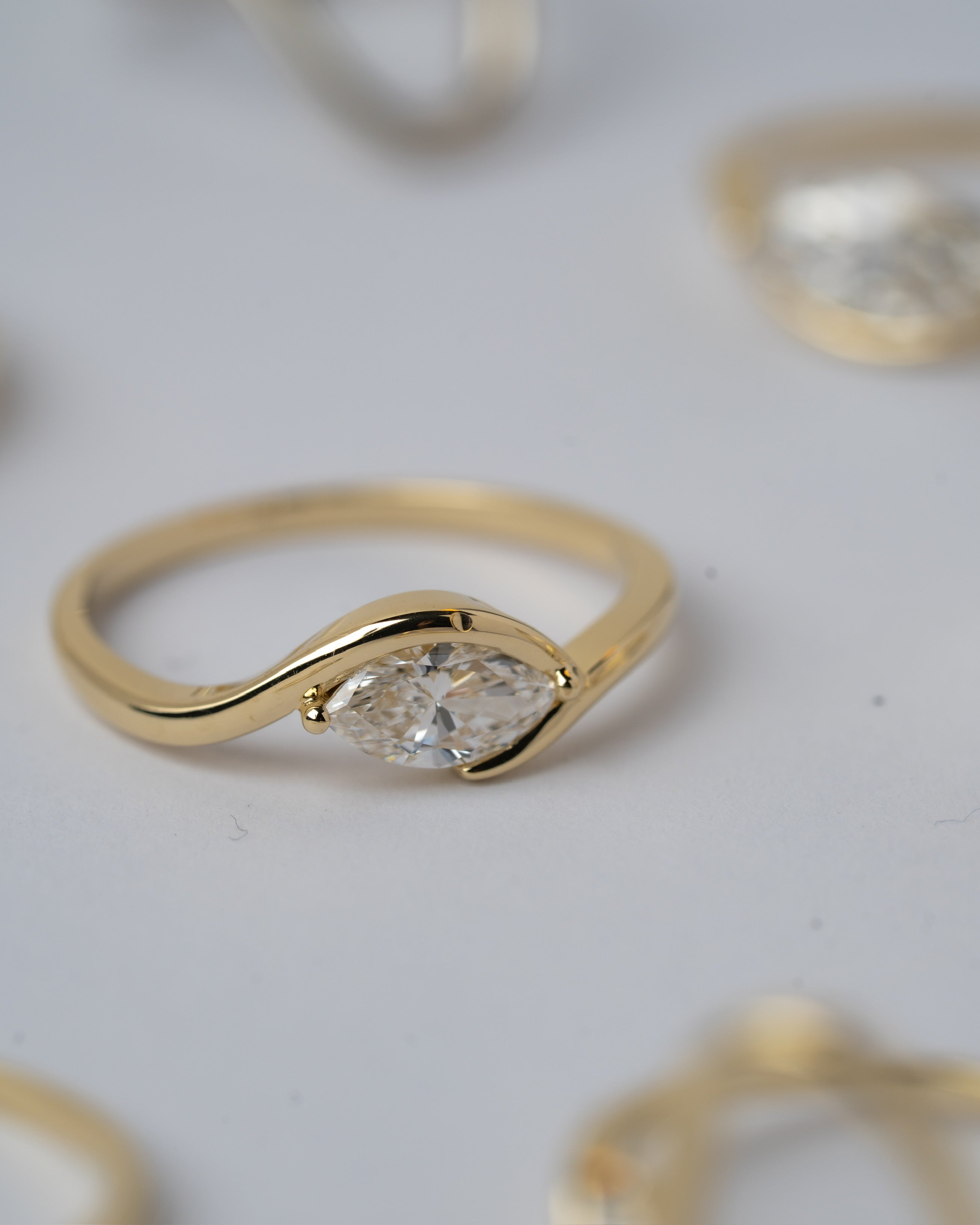 In between 1 carat lab diamond, in 14k gold.