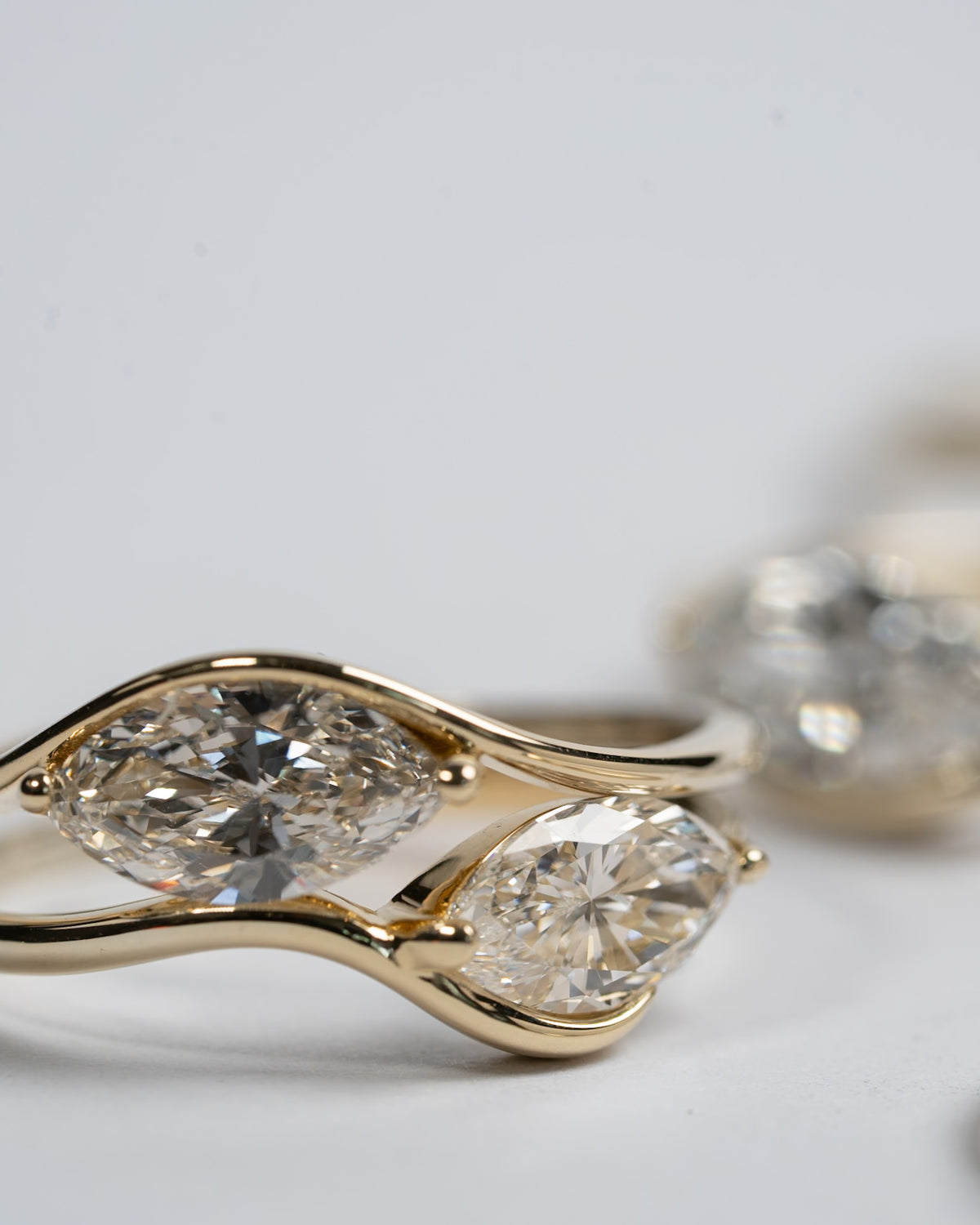 Motion rings in 14K gold with marquise diamonds, close-up