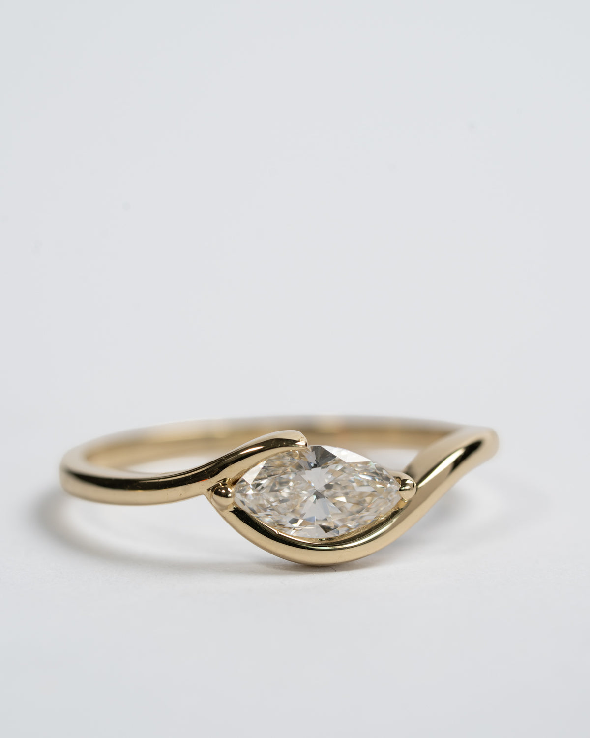 In between 1 carat lab diamond, in 14k gold.