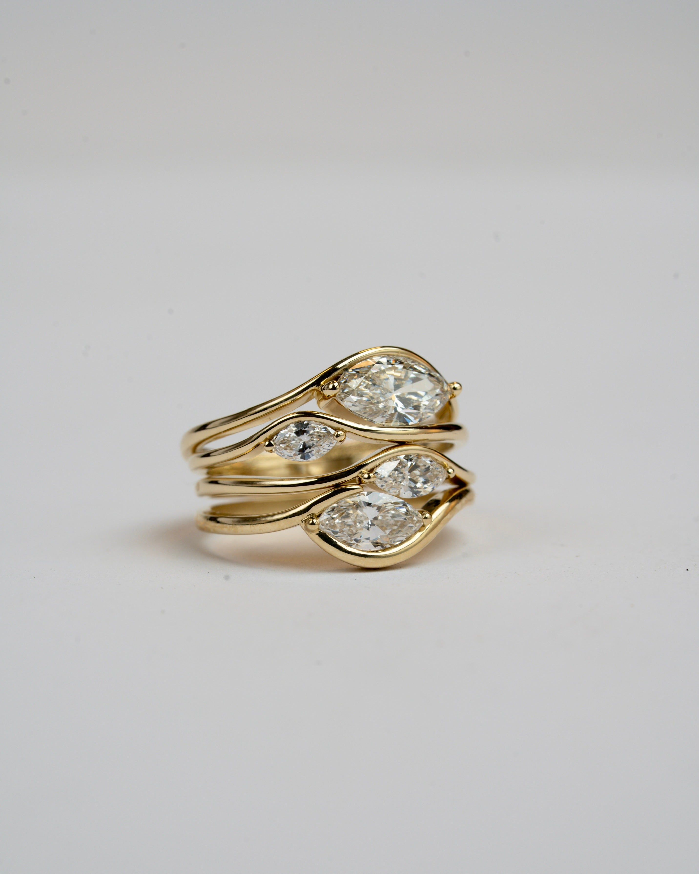 In between 1 carat lab diamond, in 14k gold.