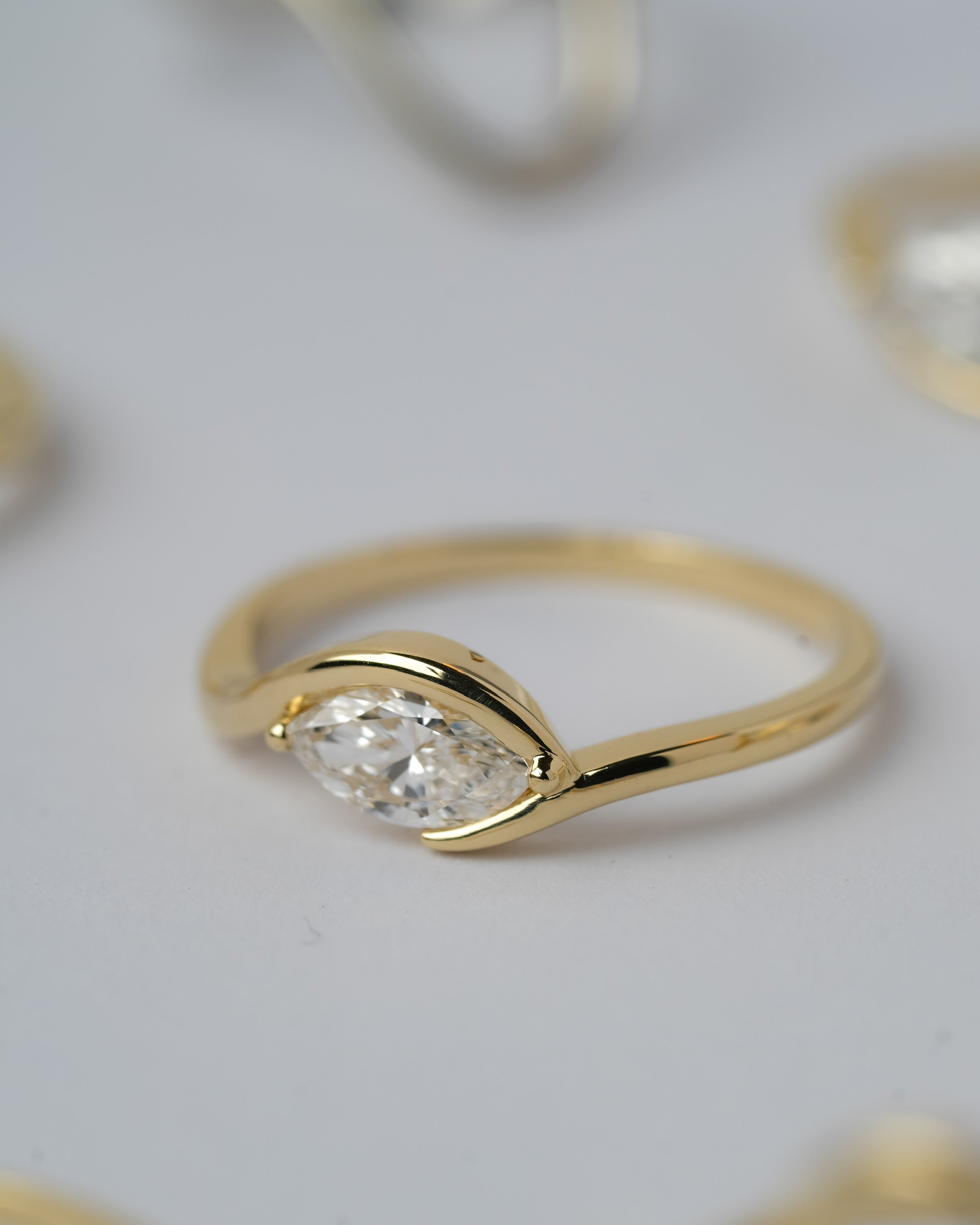 In between 1 carat lab diamond, in 14k gold.