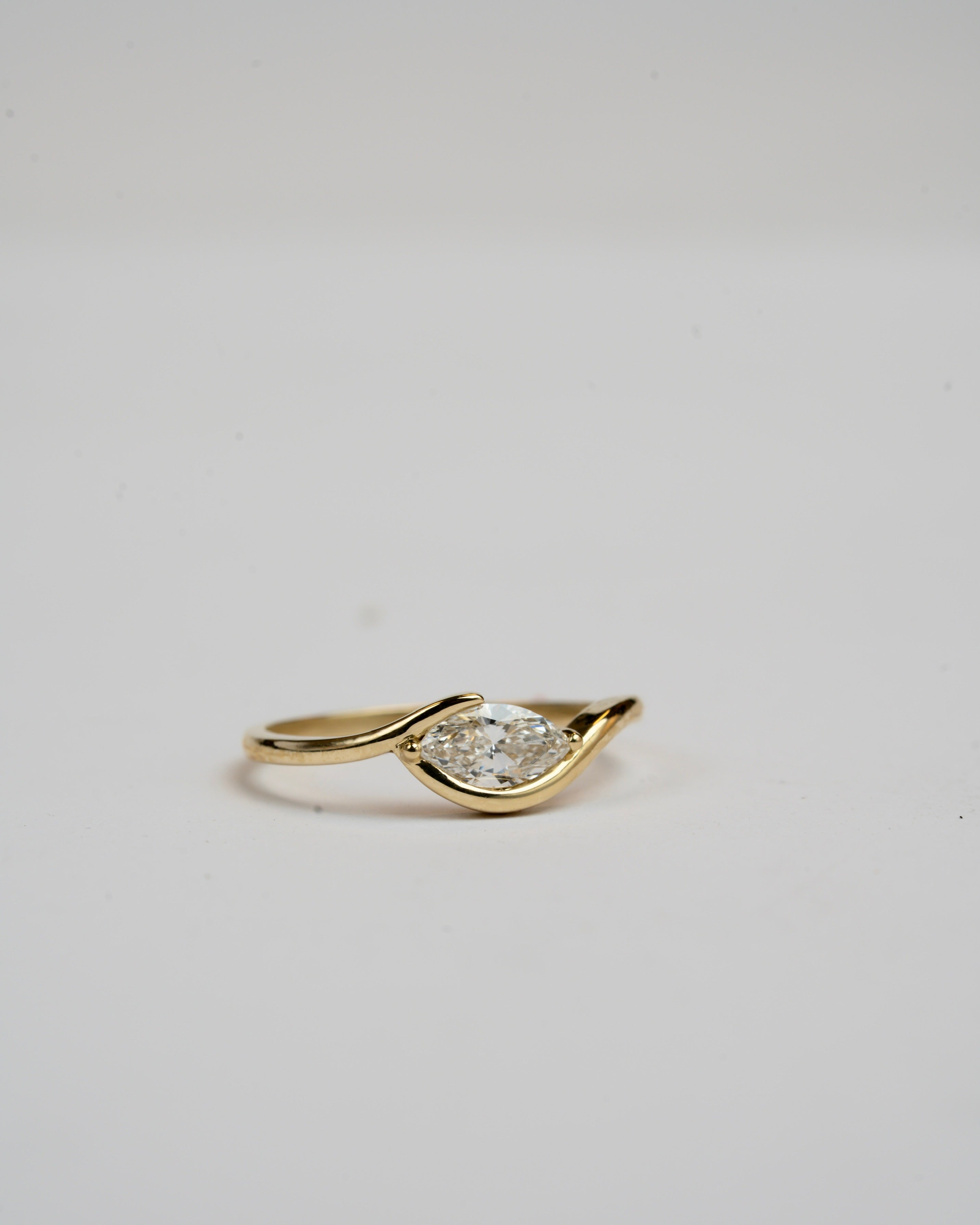 In between 1 carat lab diamond, in 14k gold.