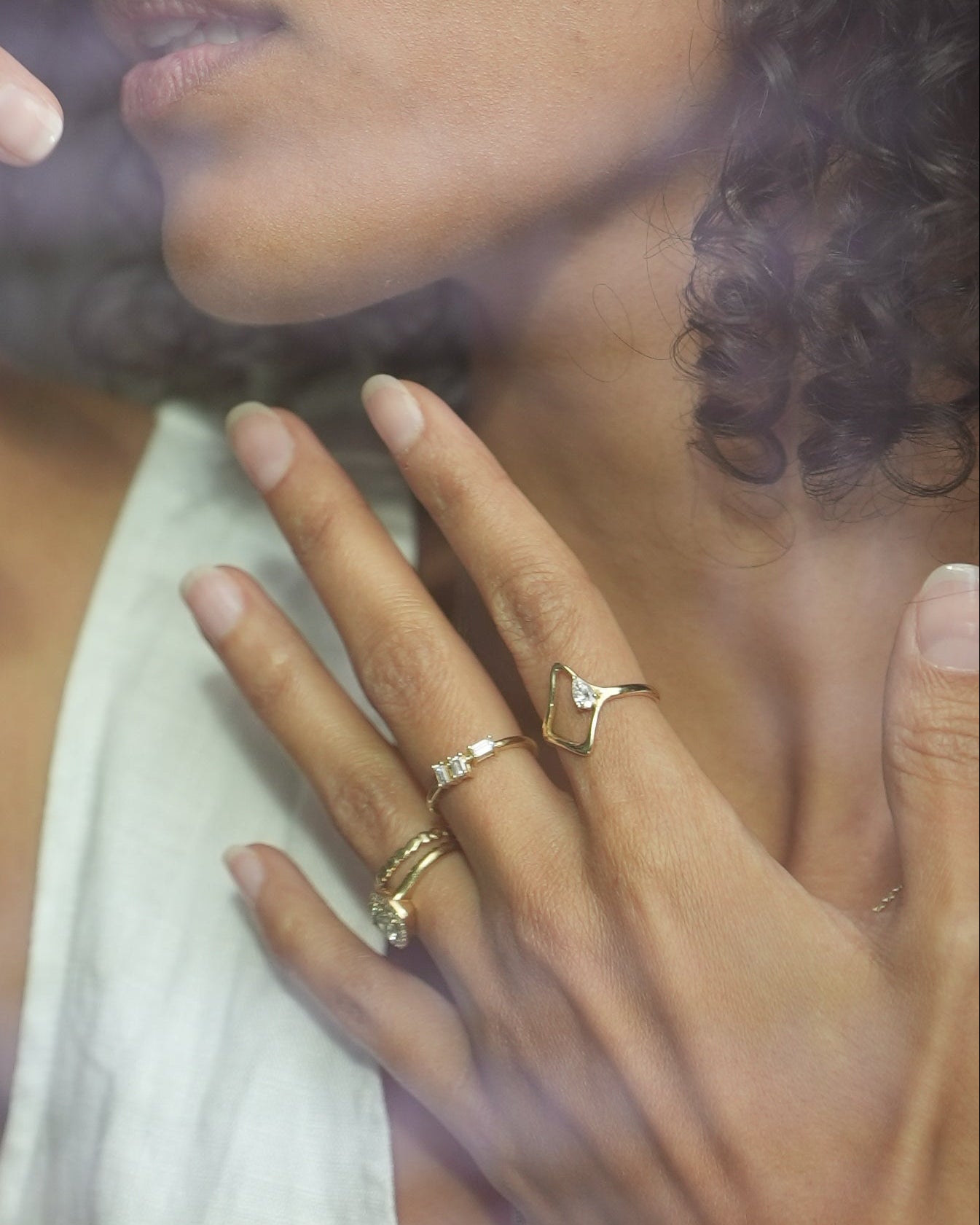 Woman with hands on her face looking through a window