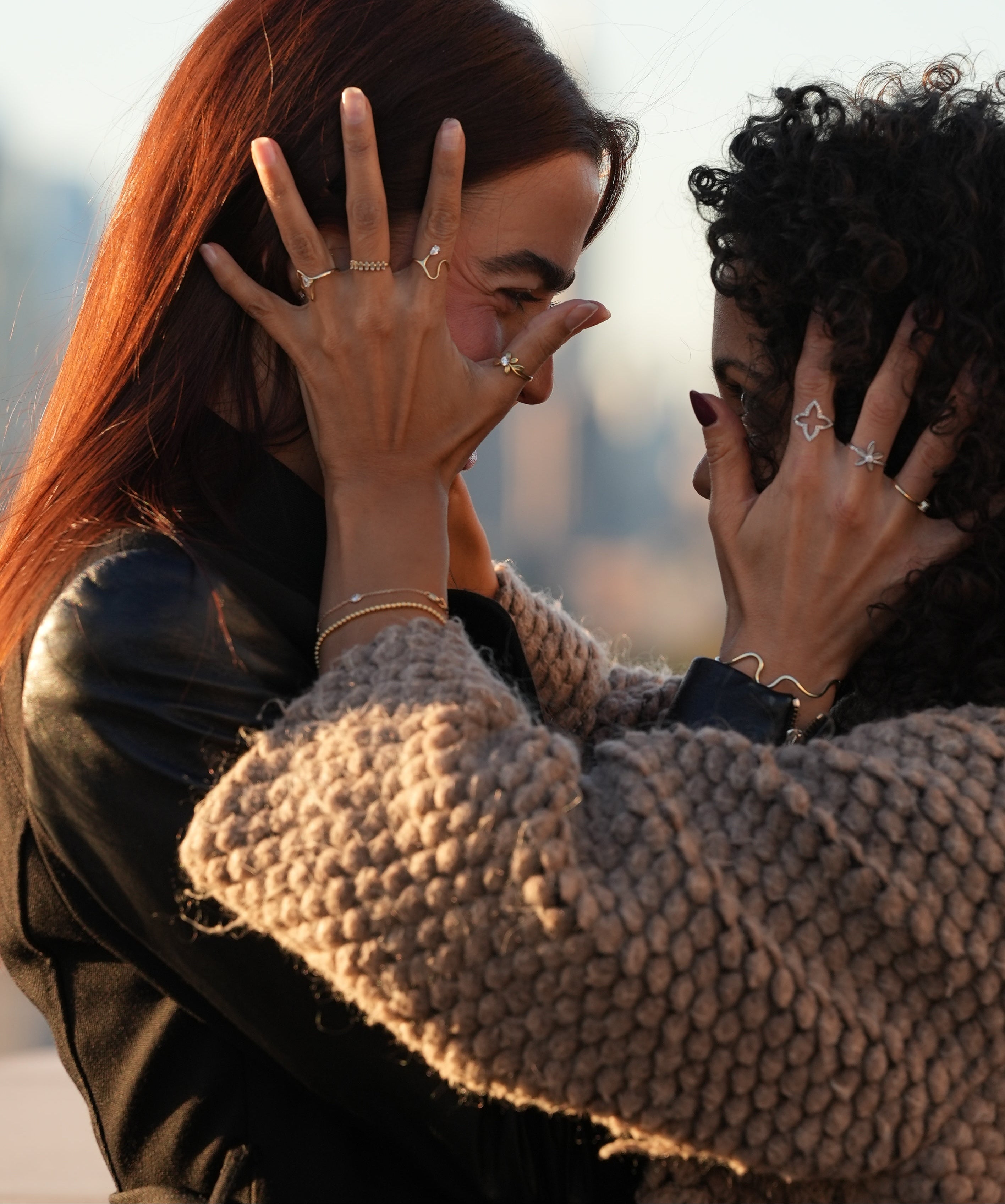 Two people embracing with a blurred background