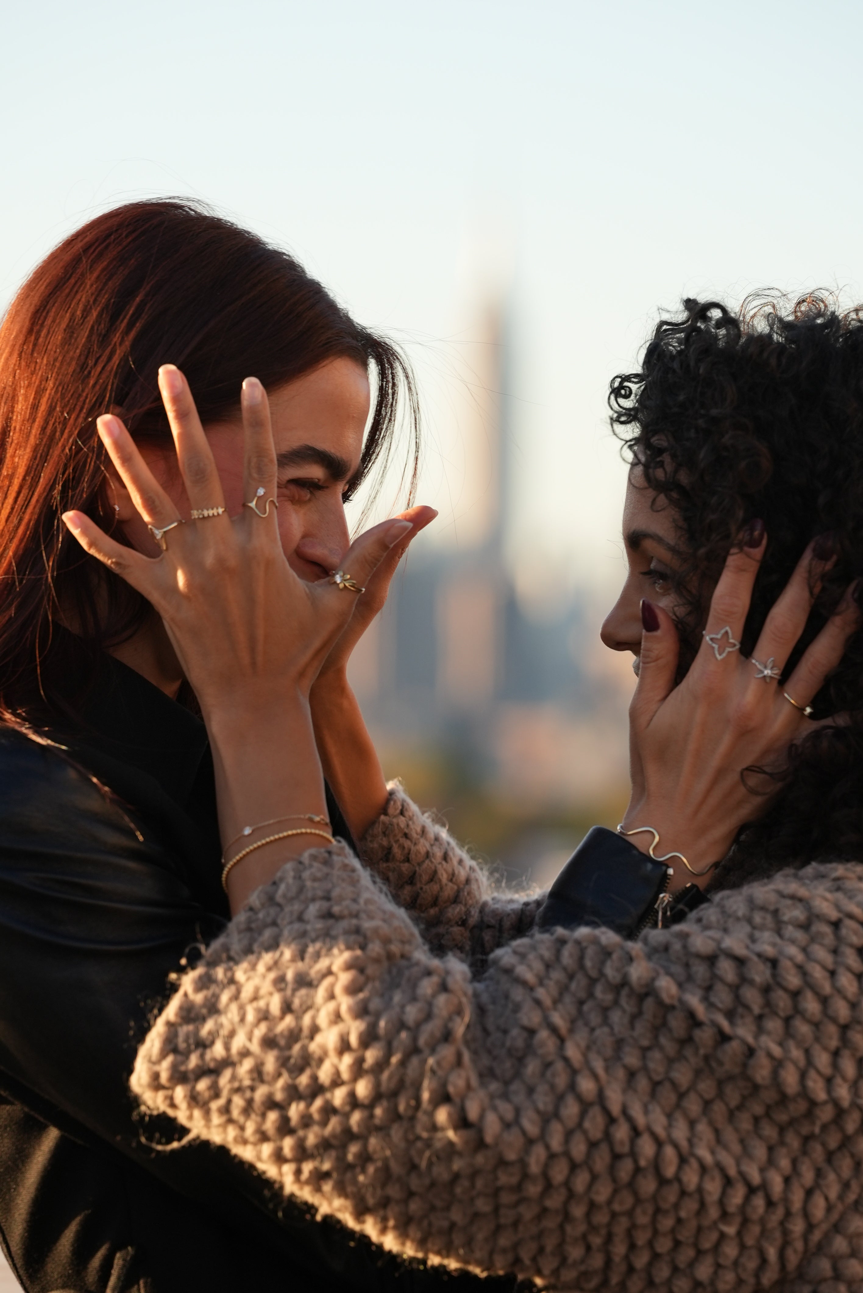 Two people embracing with a blurred background