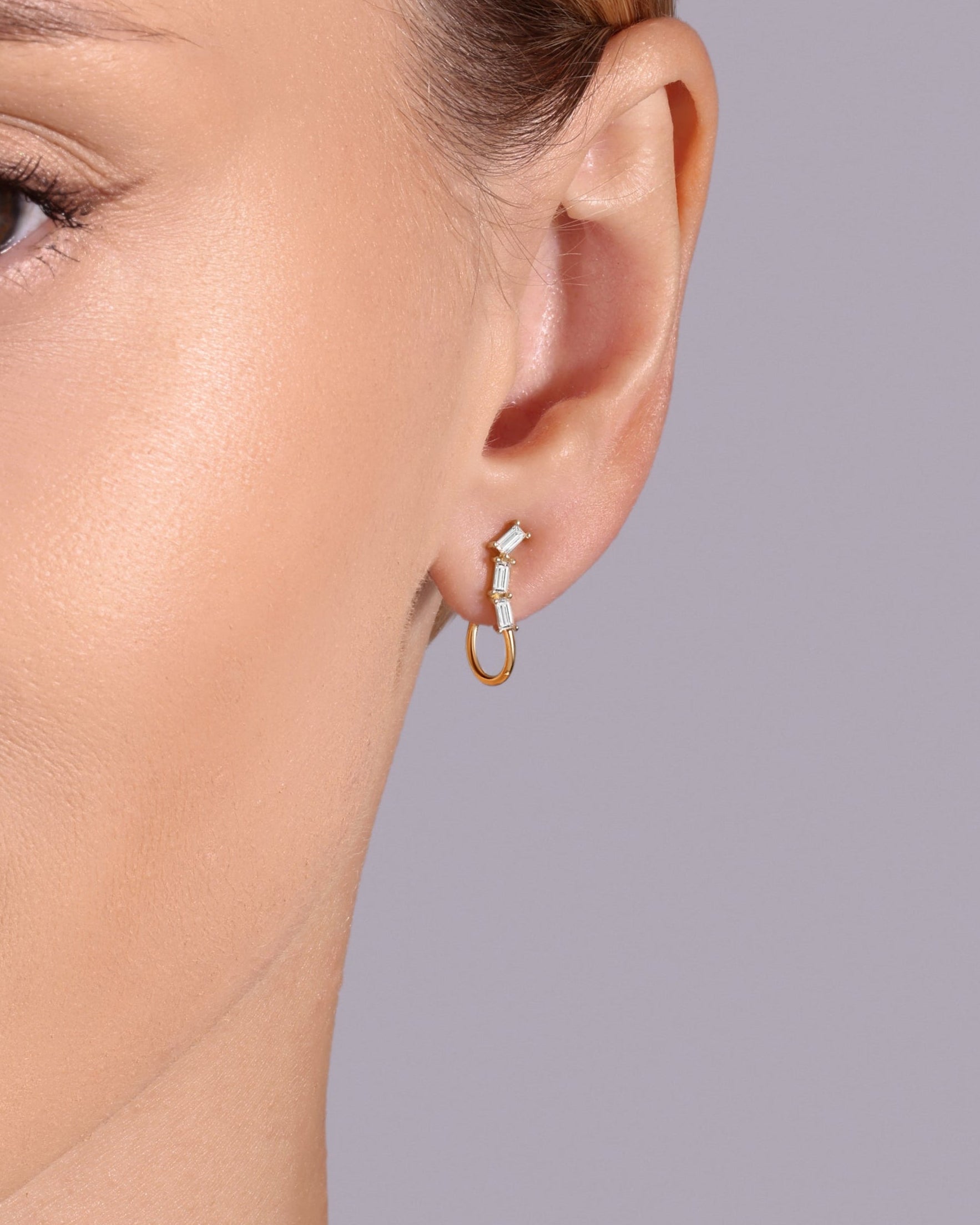 14K gold open hoop earrings with baguette diamonds