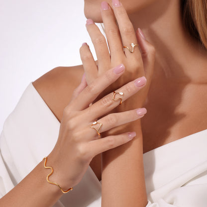 Gold wave ring with pear diamond, open geometric gold ring, delicate wave gold band, and gold wave bracelet