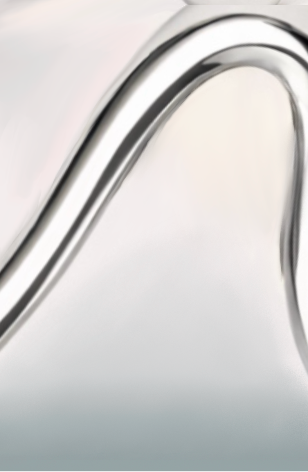 Close-up of a silver ring with a detailed design on a white background