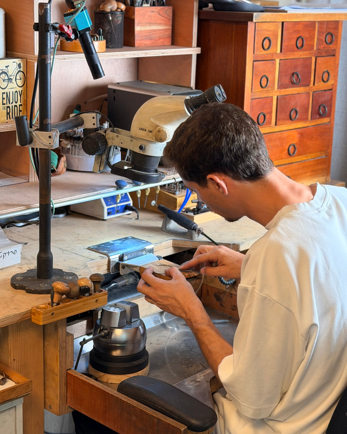 Levi Tzeiger at the workbench in his studio