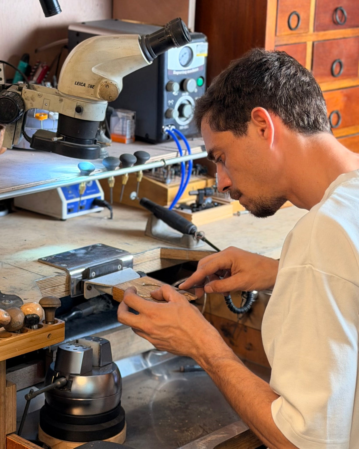 Levi Tzeiger working at the bench in his studio