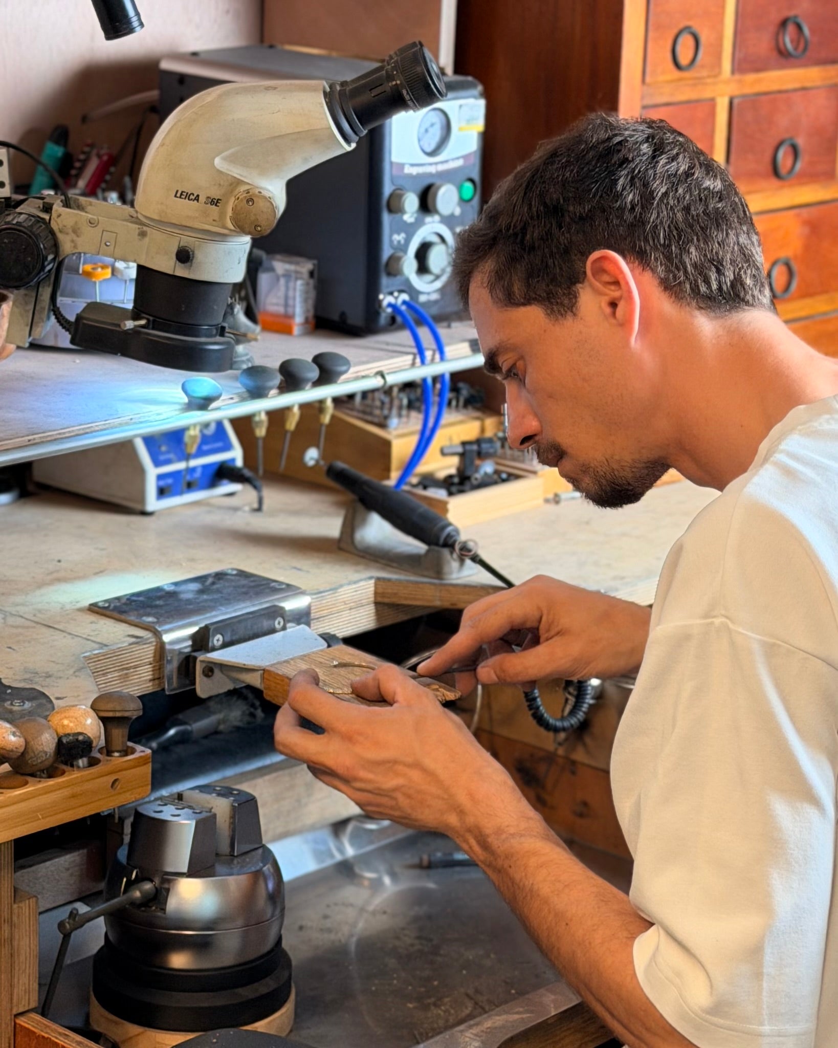 levi tzeiger working in a workshop with tools and equipment around
