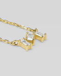 Cris necklace in 14K gold with three natural baguette diamonds