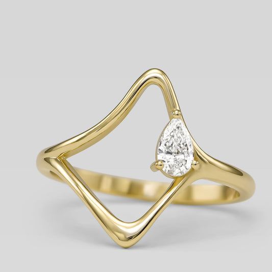 14K gold wave ring with pear-shaped diamond