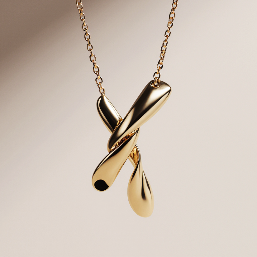 Gold necklace with a unique pendant on a beige background