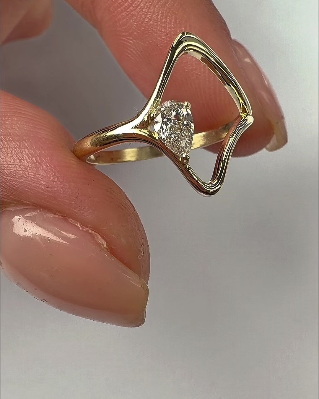 Gaia ring in 14K gold, an open frame with a natural pear diamond, video